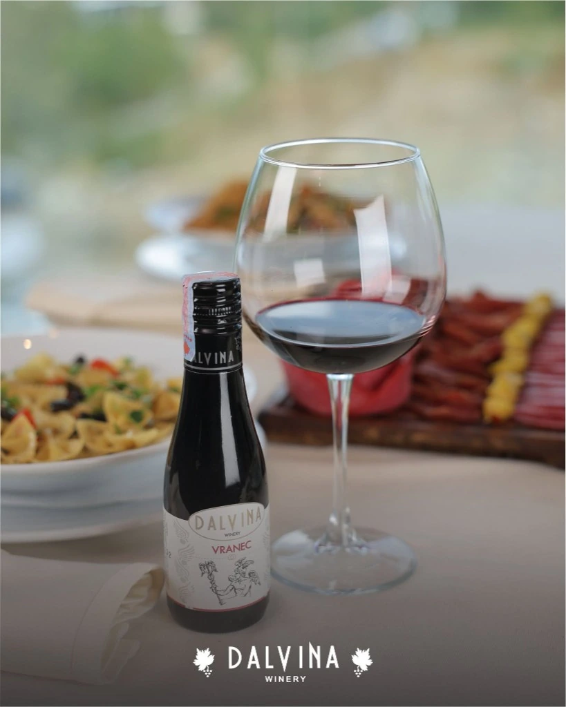 Dalvina Hermes Syrah red wine bottle with glass