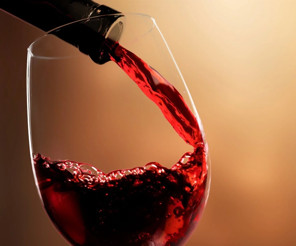 Dalvina red wine being poured into a glass