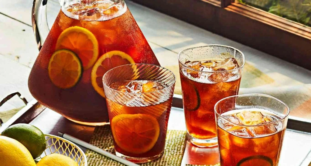 Juicy iced tea with lemon and lime served outdoors