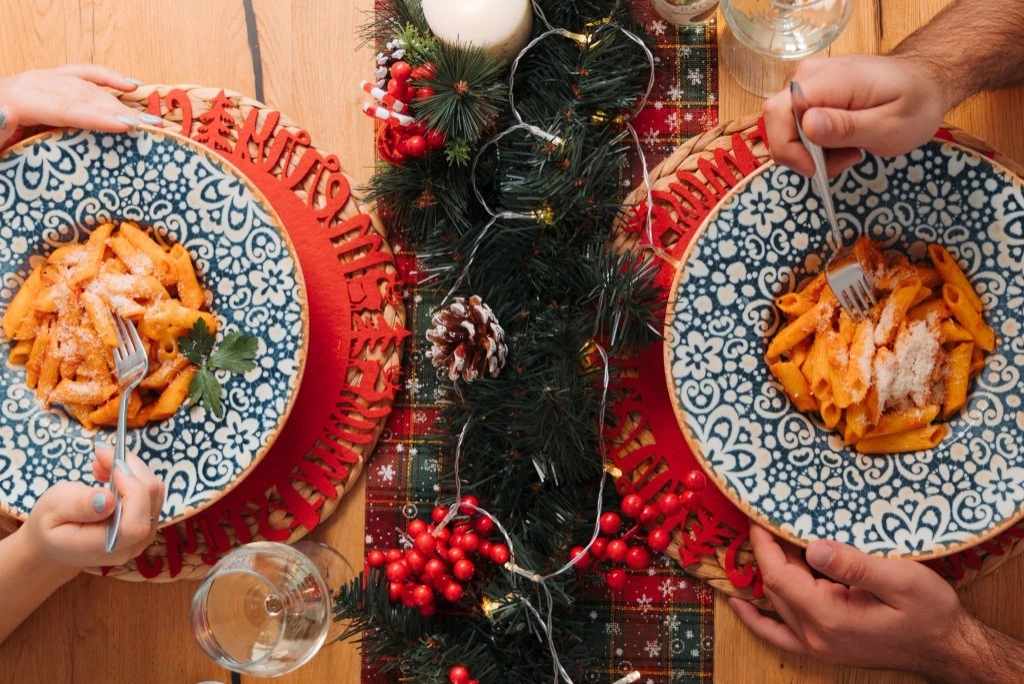 Sharing Pantanella penne pasta at a festive dinner table