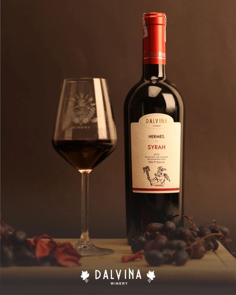 Pouring Dalvina red wine into a glass