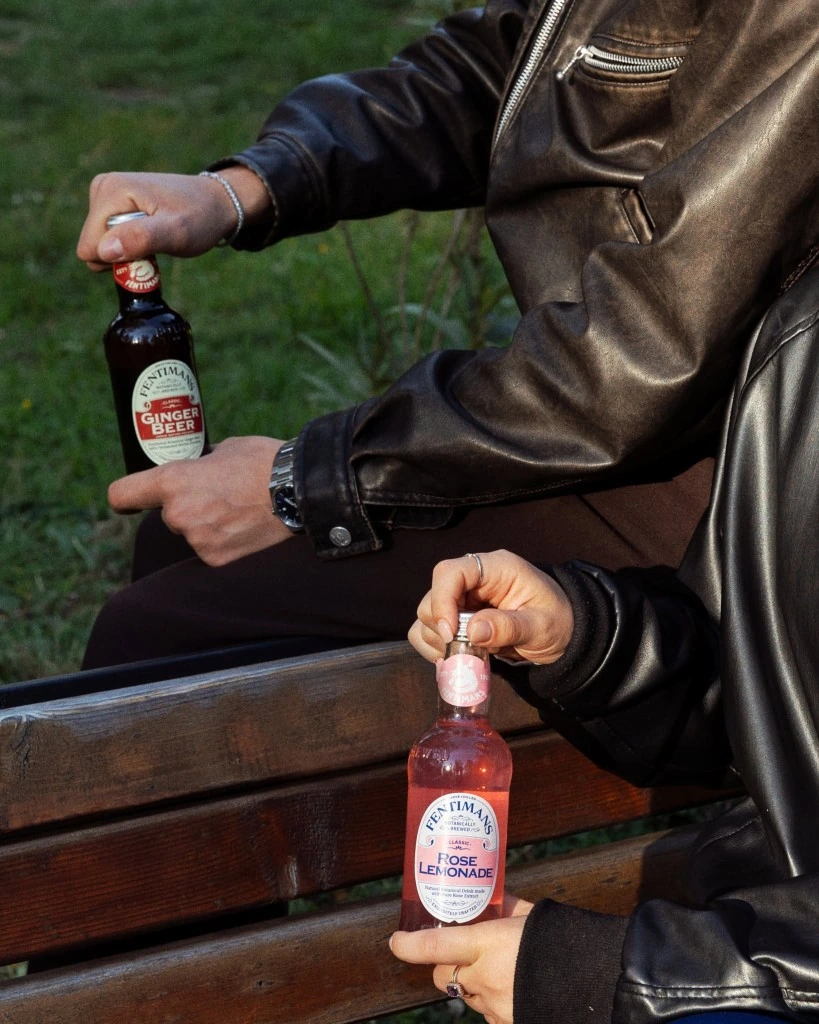 Friends enjoying Fentimans Ginger Beer and Rose Lemonade outdoors