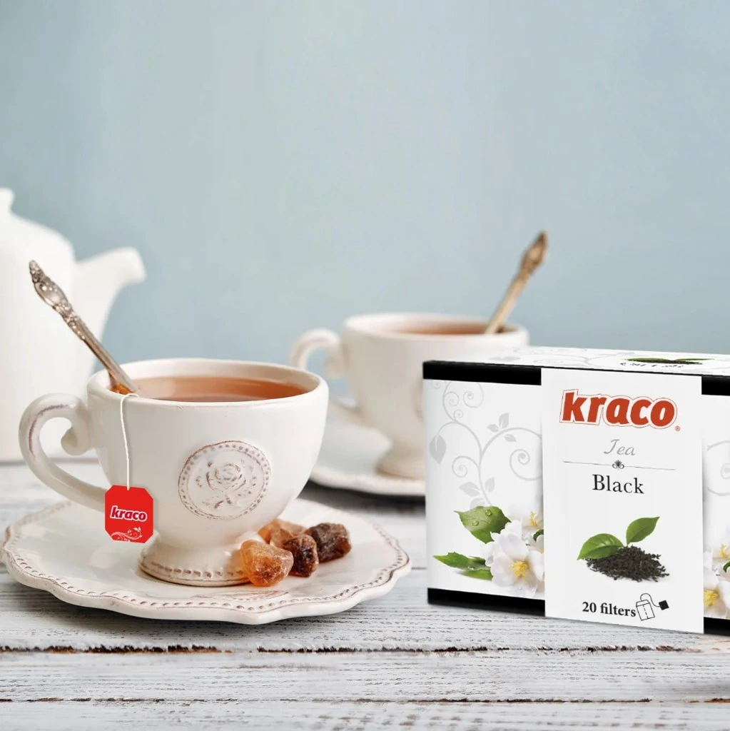 KRACO bio tea box with green tea in a glass cup