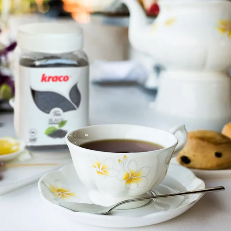 KRACO lemon infusion tea setup with teapot and ginger
