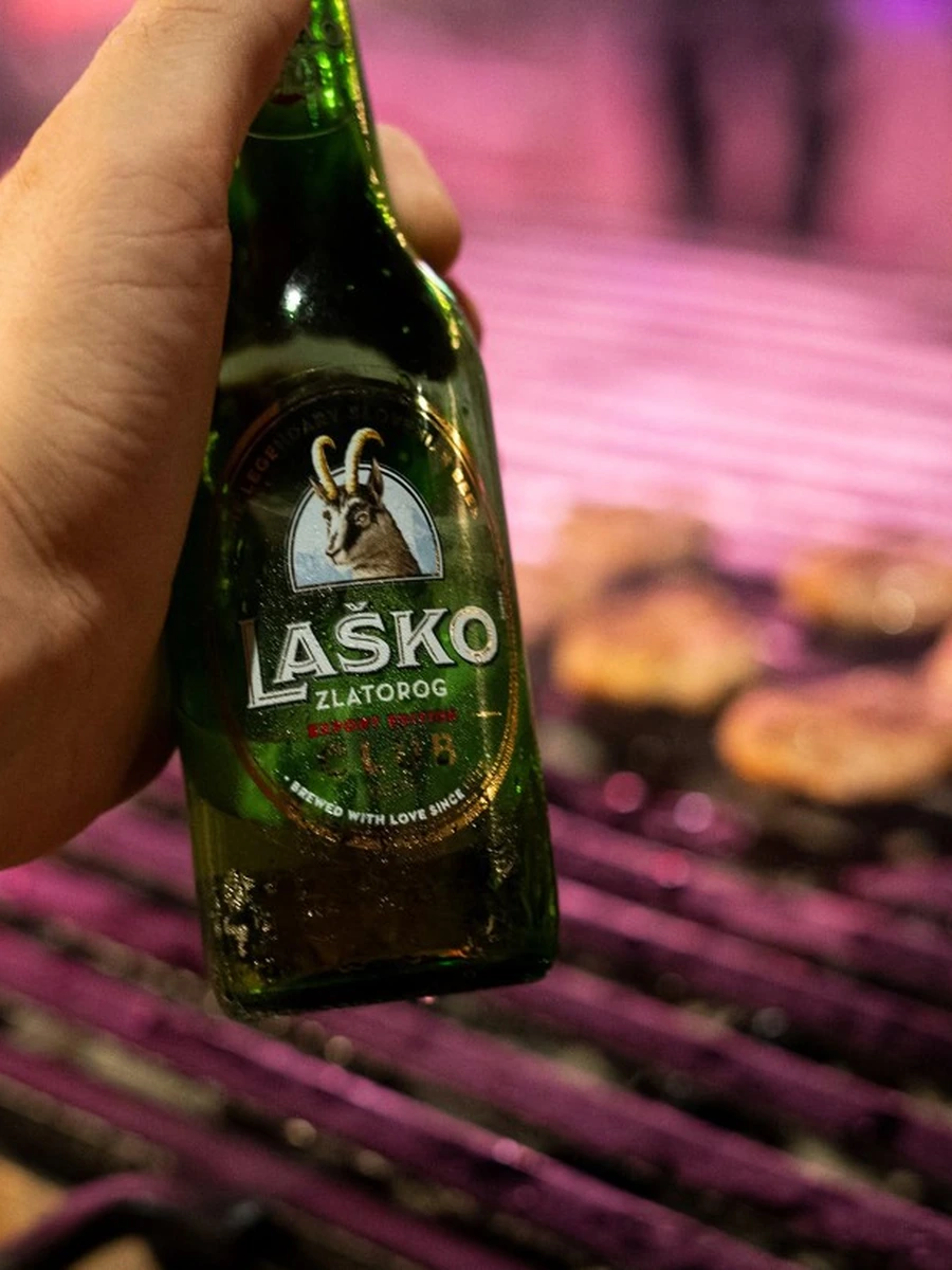 Laško Zlatorog beer at an outdoor grill event