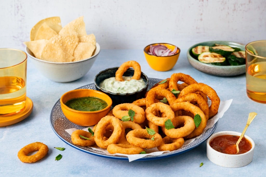 La Le Duc onion rings served with dipping sauces