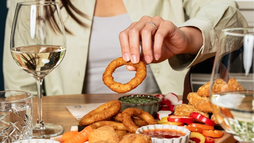 La Le Duc appetizers shared with wine at the table