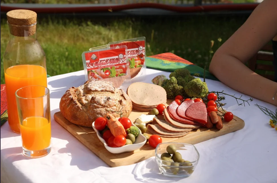 Food Division spread with bread, meats, and juice
